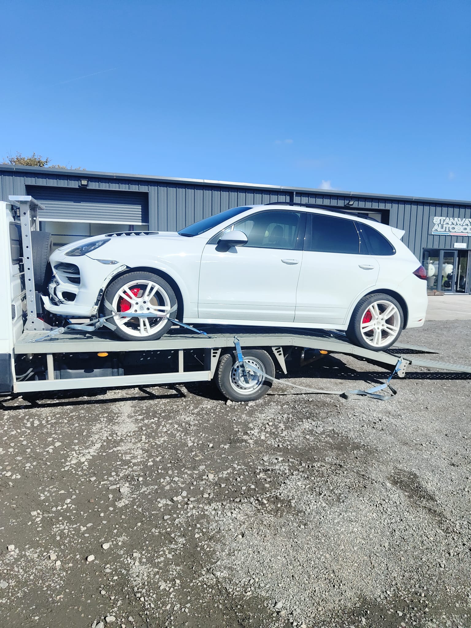 White Porsche Cayenne on recovery truck